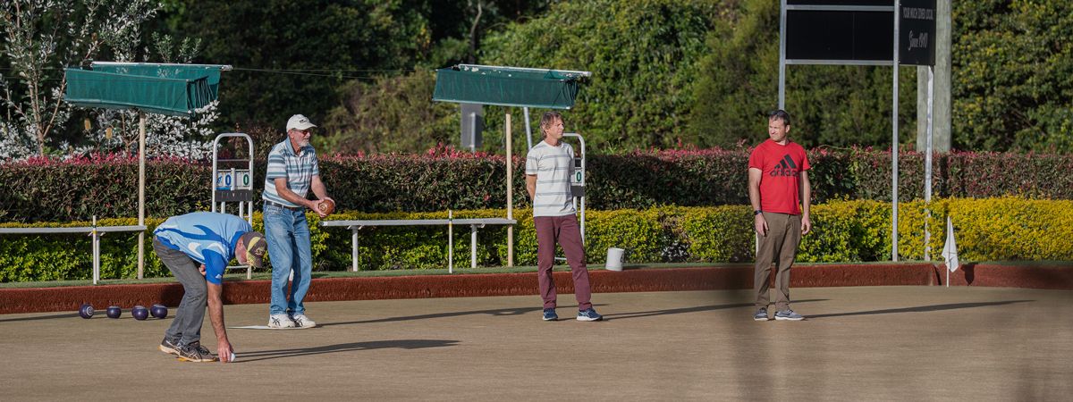 Bowlers on the green today, with the palm-lined gardens behind